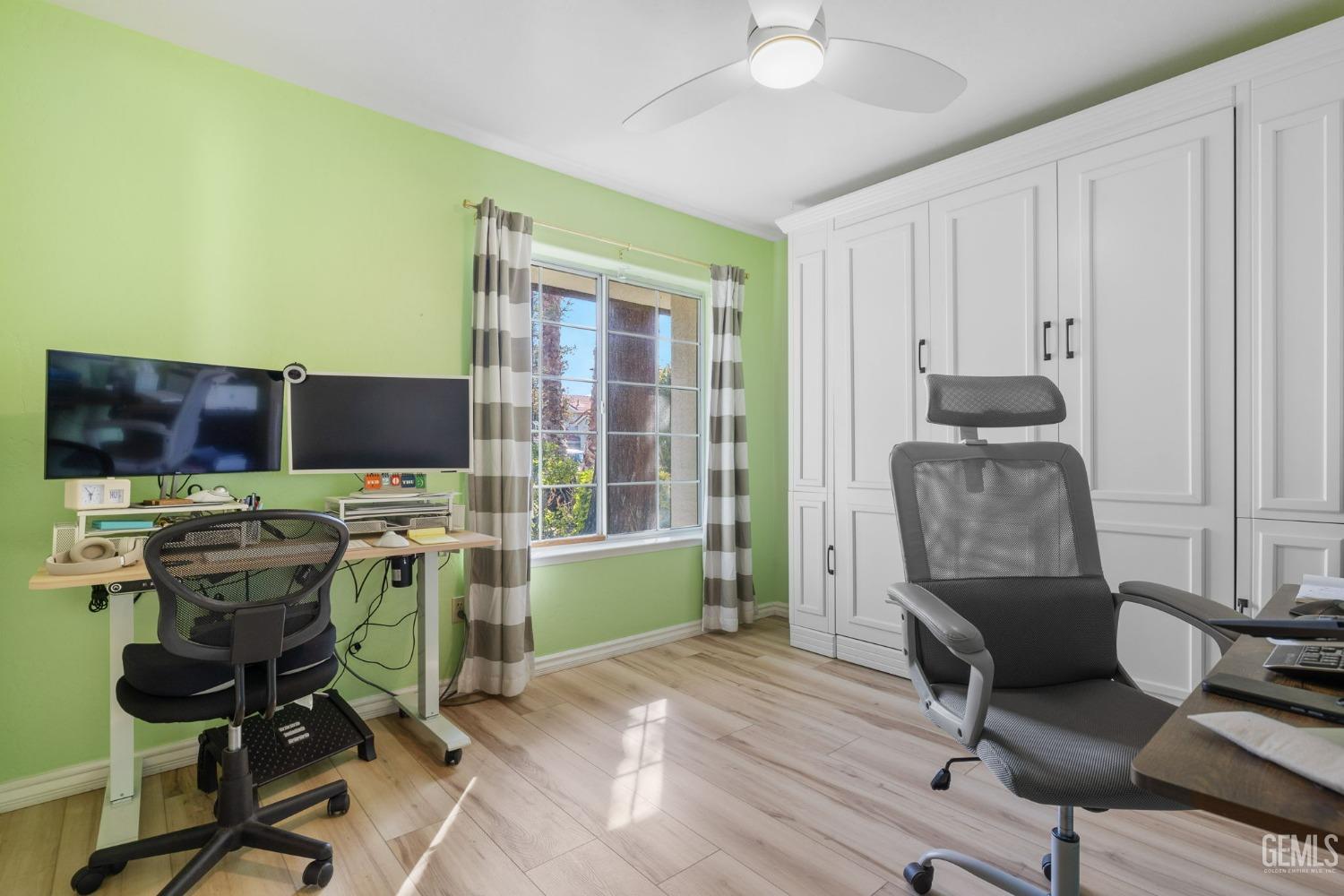 Undisclosed Address Bakersfield, CA 93311 - Photo 46 of 69 a view of a workspace with furniture and a window