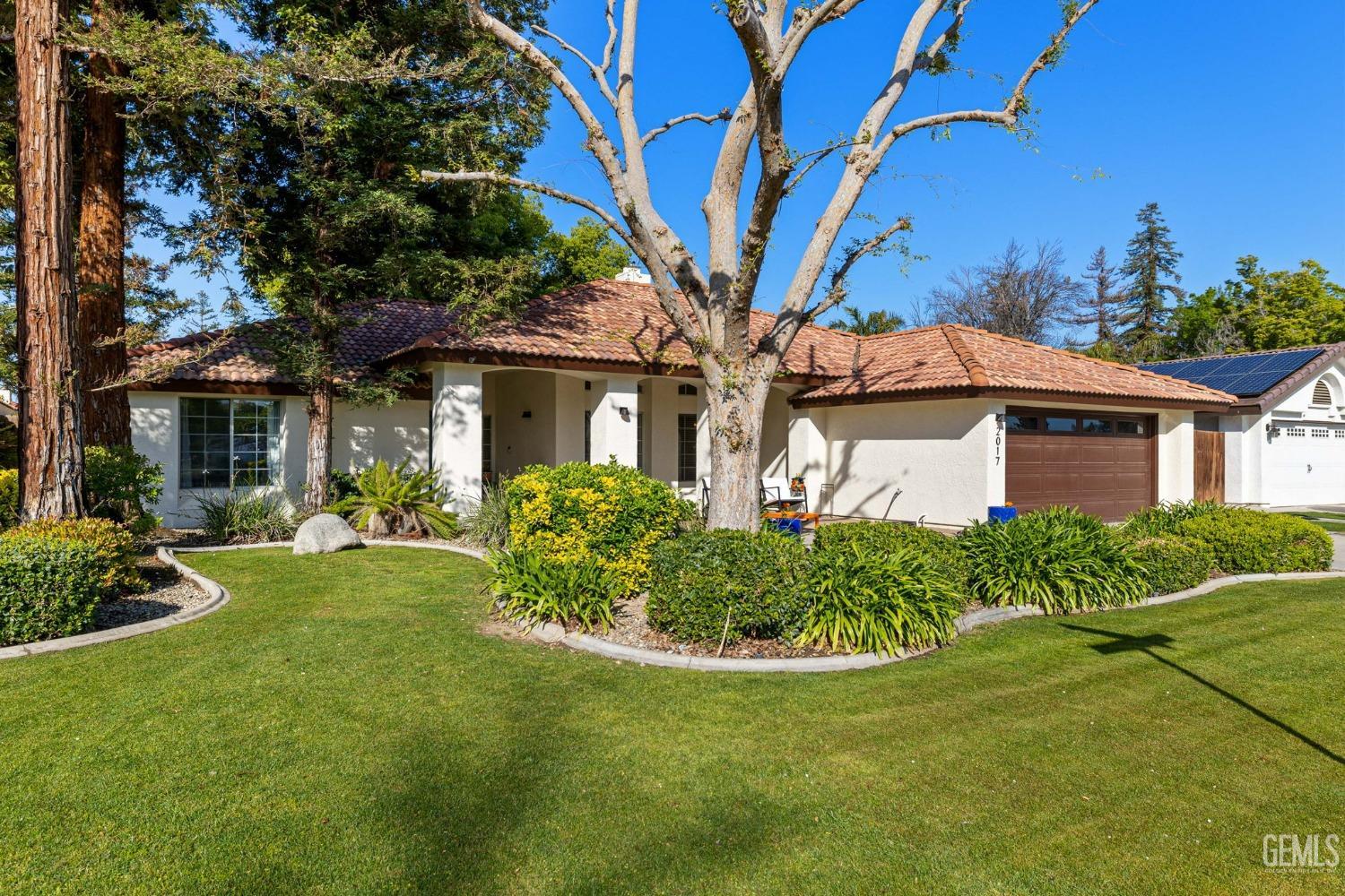 Undisclosed Address Bakersfield, CA 93311 - Photo 6 of 69 a front view of a house with garden