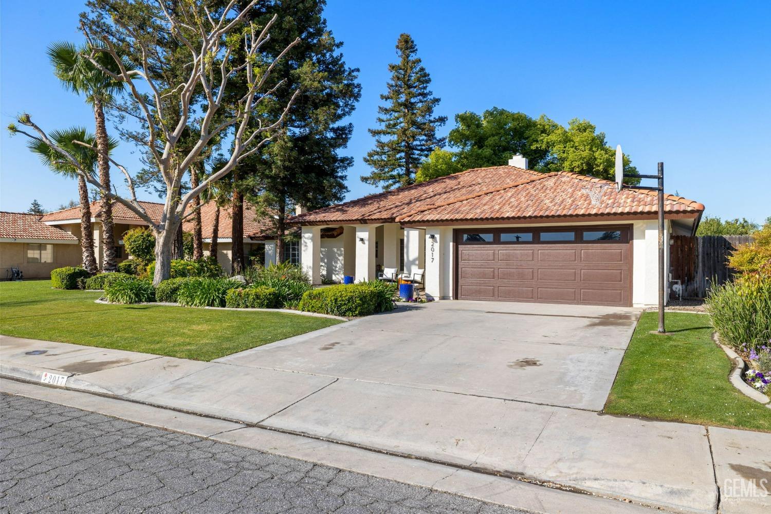 Undisclosed Address Bakersfield, CA 93311 - Photo 7 of 69 a front view of a house with a yard