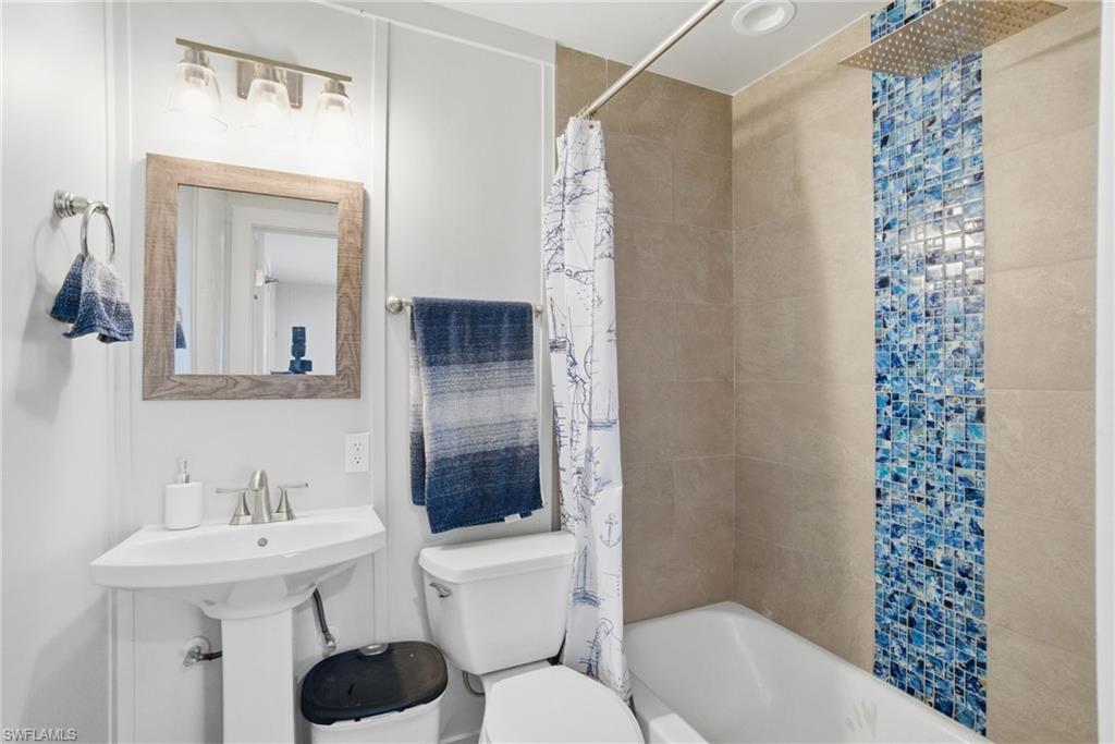 1286 Venetian Way Naples, FL 34110 - Photo 28 of 46 a bathroom with a sink toilet and shower