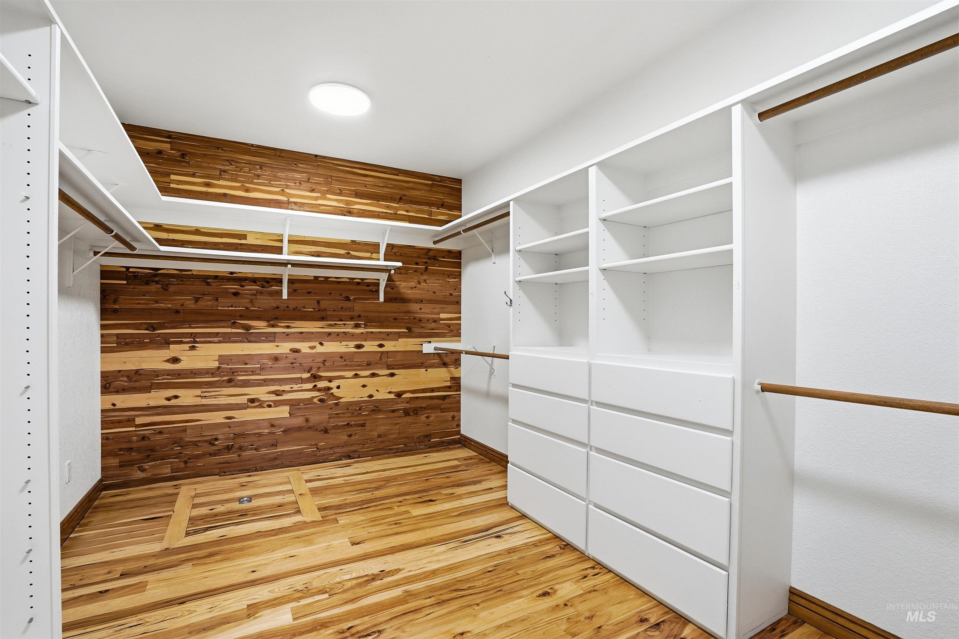12730 Sunny Slope Road Caldwell, ID 83607 - Photo 30 of 50 Walk in closet with light wood-style floors