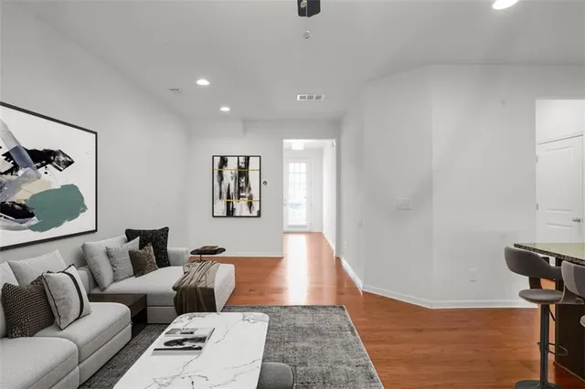 a living room with furniture and a rug