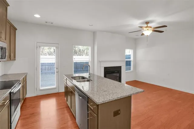 a kitchen with a stove and a kitchen island