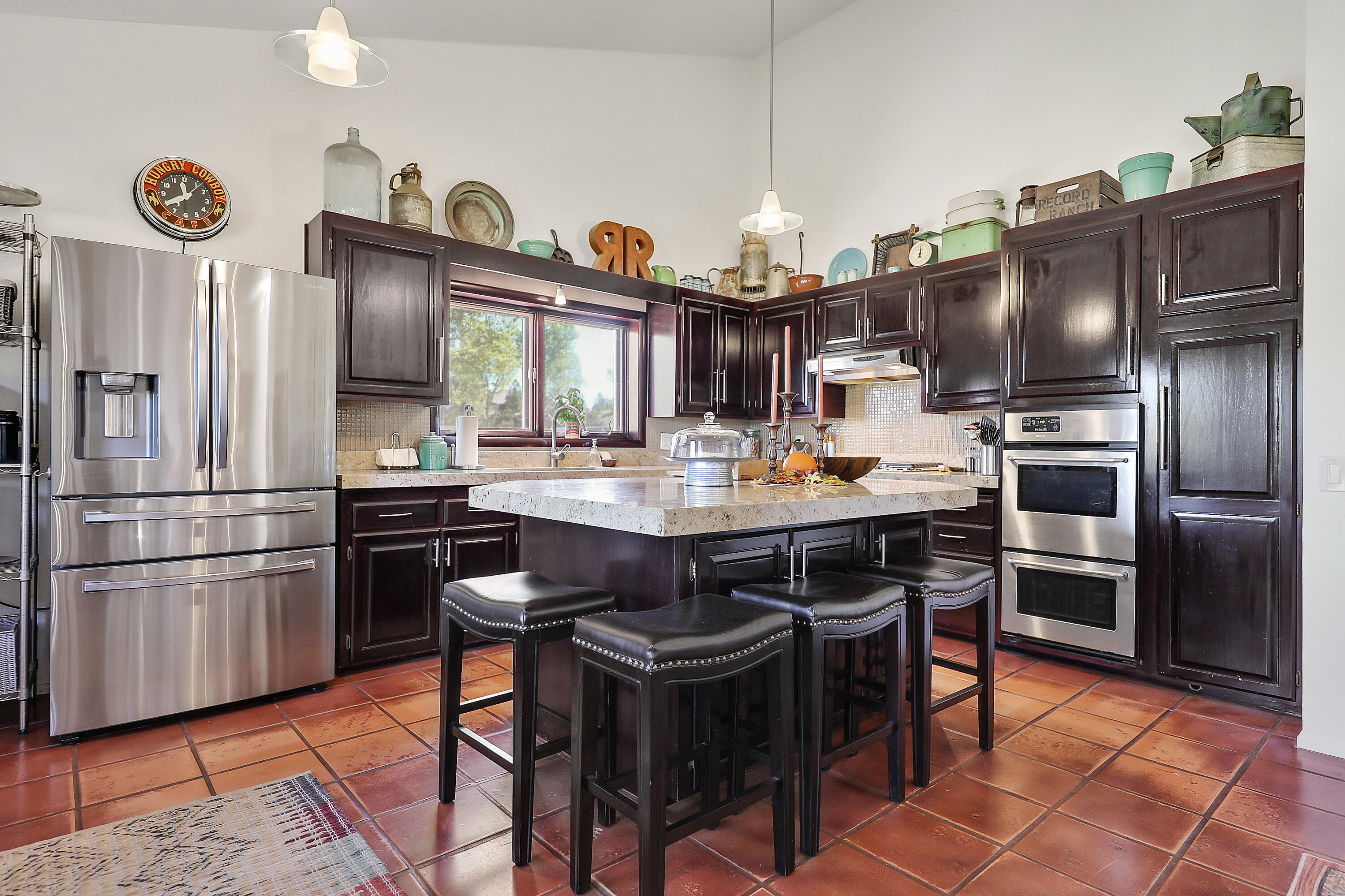 60195 Hop Patch Spring Road Mountain Center, CA 92561 - Photo 11 of 50 a kitchen with stainless steel appliances granite countertop a sink a stove and a refrigerator