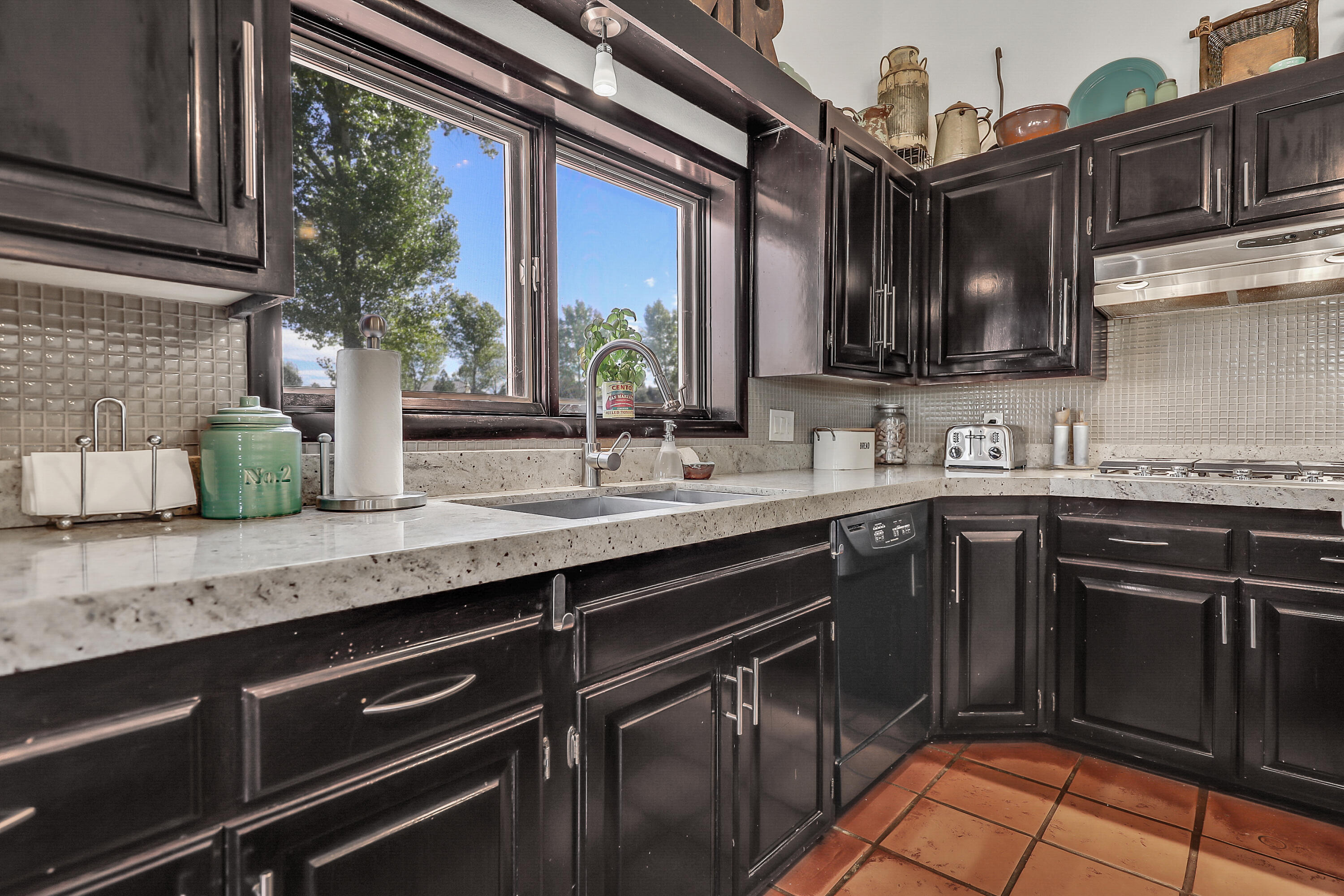 60195 Hop Patch Spring Road Mountain Center, CA 92561 - Photo 13 of 50 a kitchen with granite countertop a sink and cabinets
