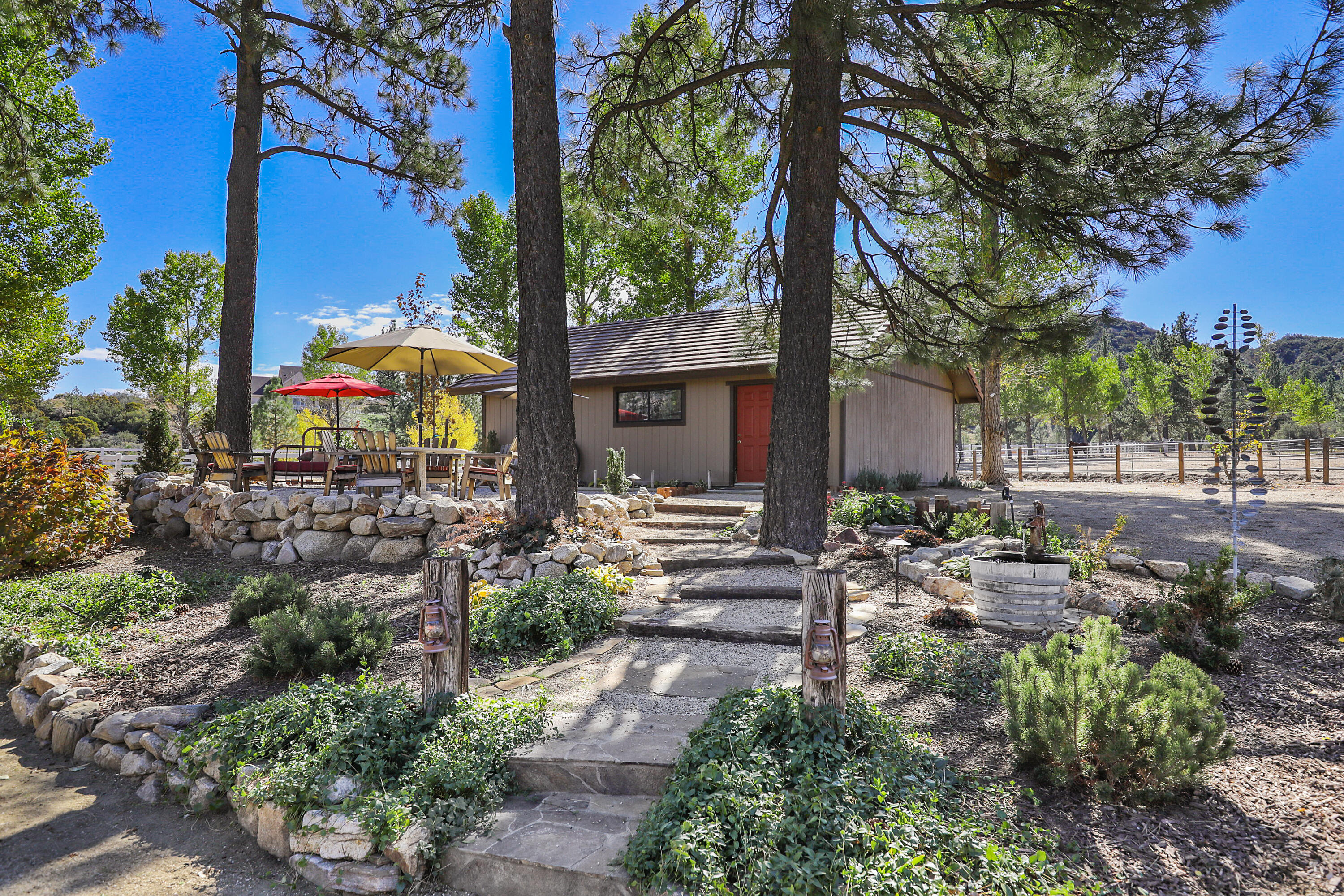 60195 Hop Patch Spring Road Mountain Center, CA 92561 - Photo 31 of 50 a backyard of a house with lots of green space