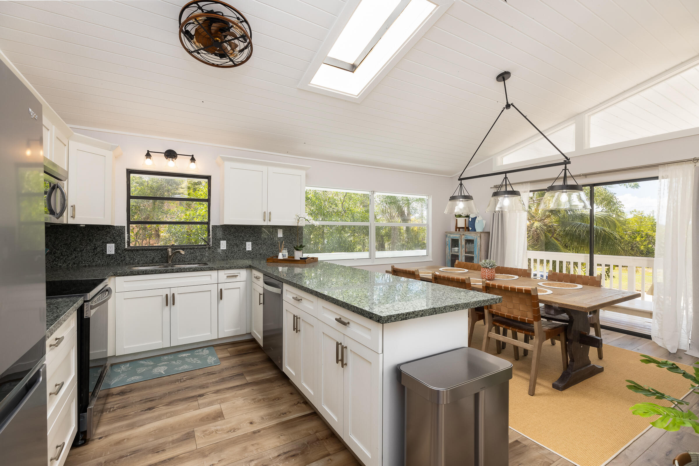 15 Sunset Road Key Largo, FL 33037 - Photo 12 of 58 a kitchen with a stove a sink and a refrigerator