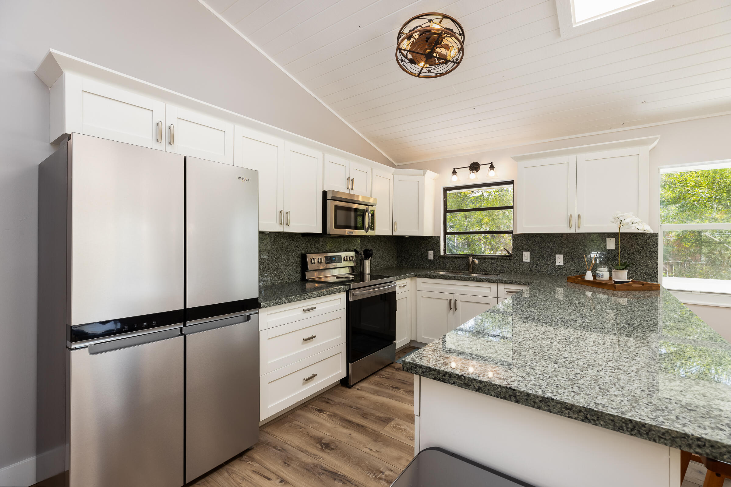 15 Sunset Road Key Largo, FL 33037 - Photo 15 of 58 a kitchen with granite countertop a refrigerator a stove a sink and dishwasher