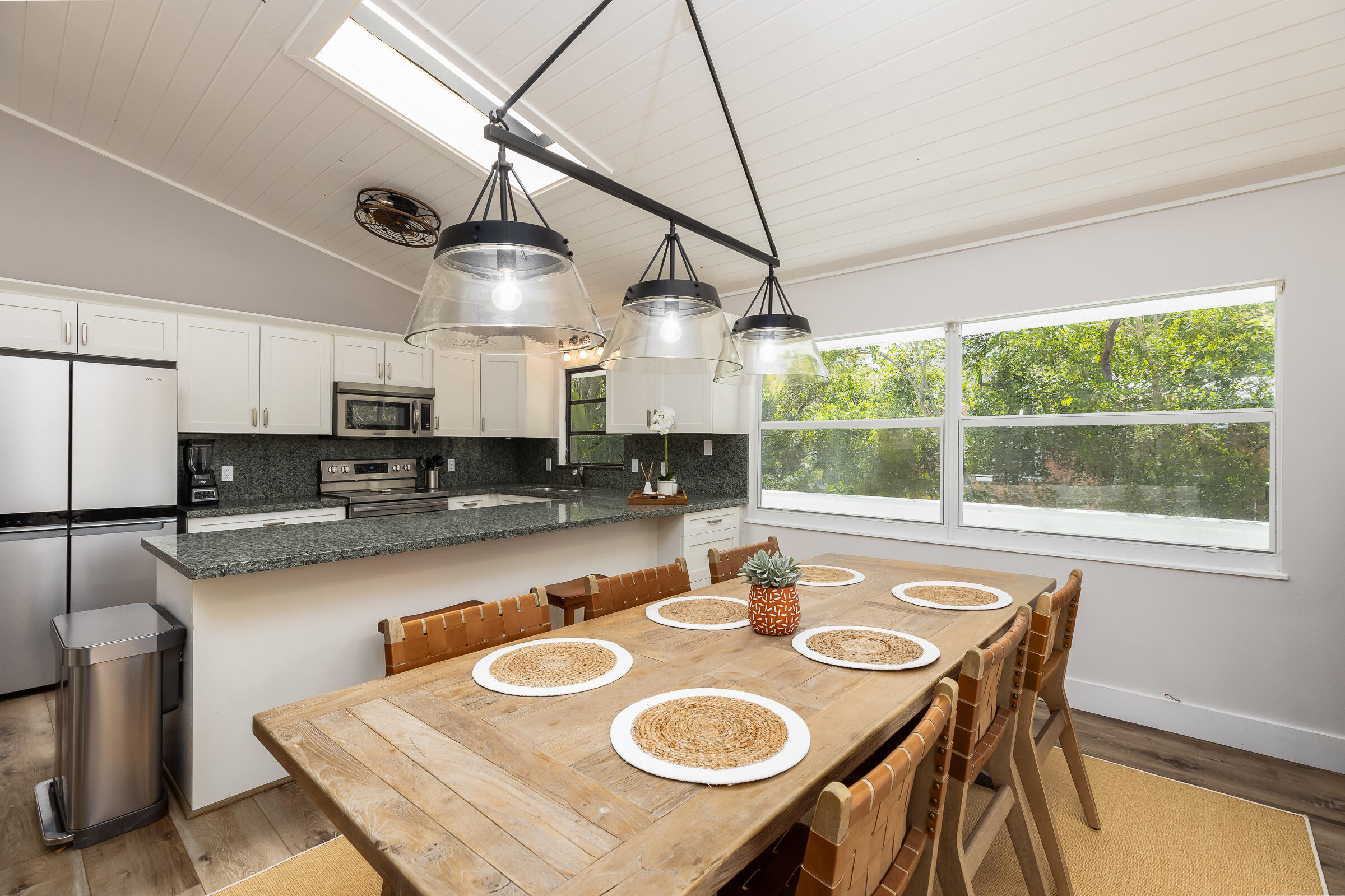 15 Sunset Road Key Largo, FL 33037 - Photo 20 of 58 a kitchen with a table chairs stove and refrigerator