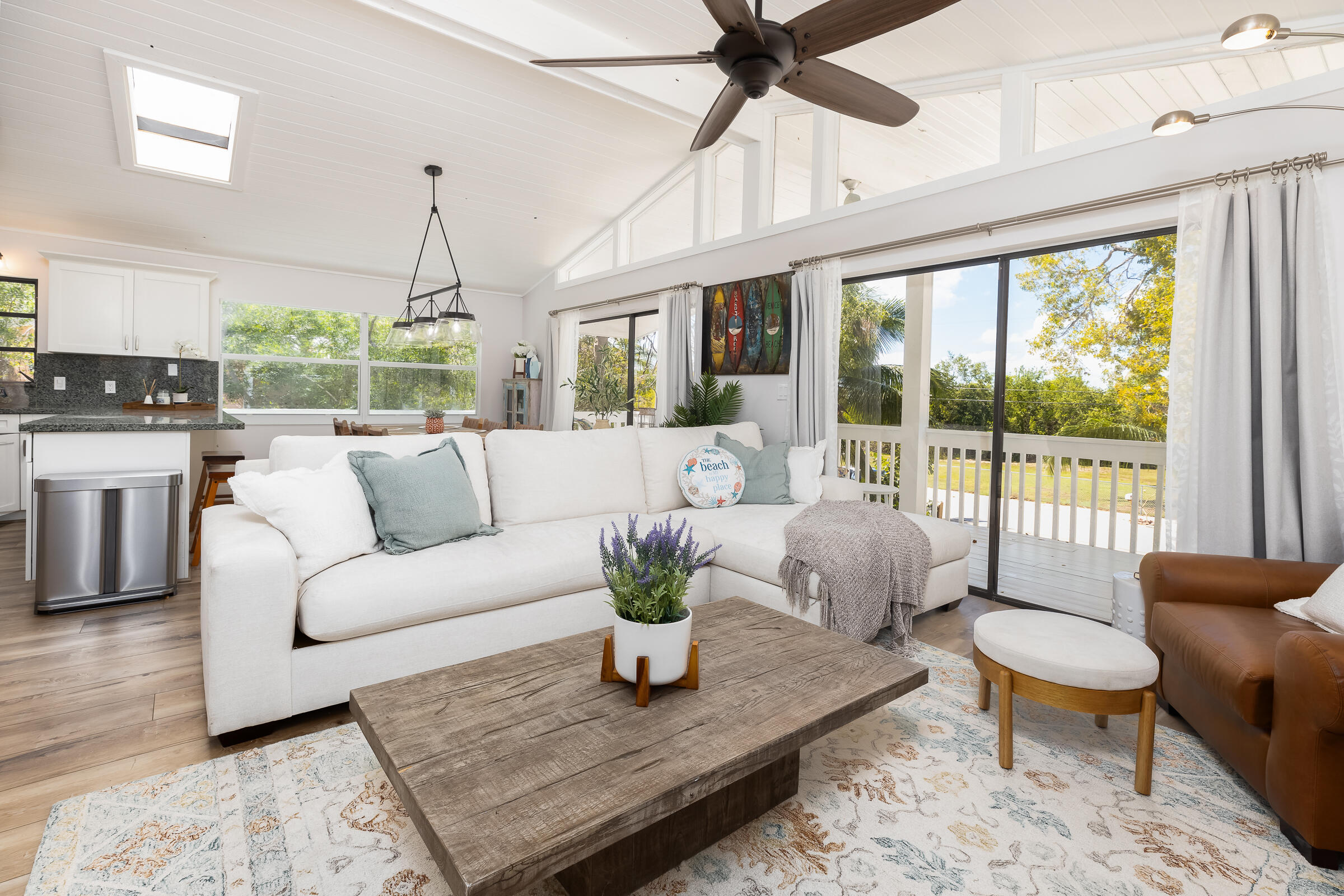 15 Sunset Road Key Largo, FL 33037 - Photo 2 of 58 a living room with furniture large windows and wooden floor