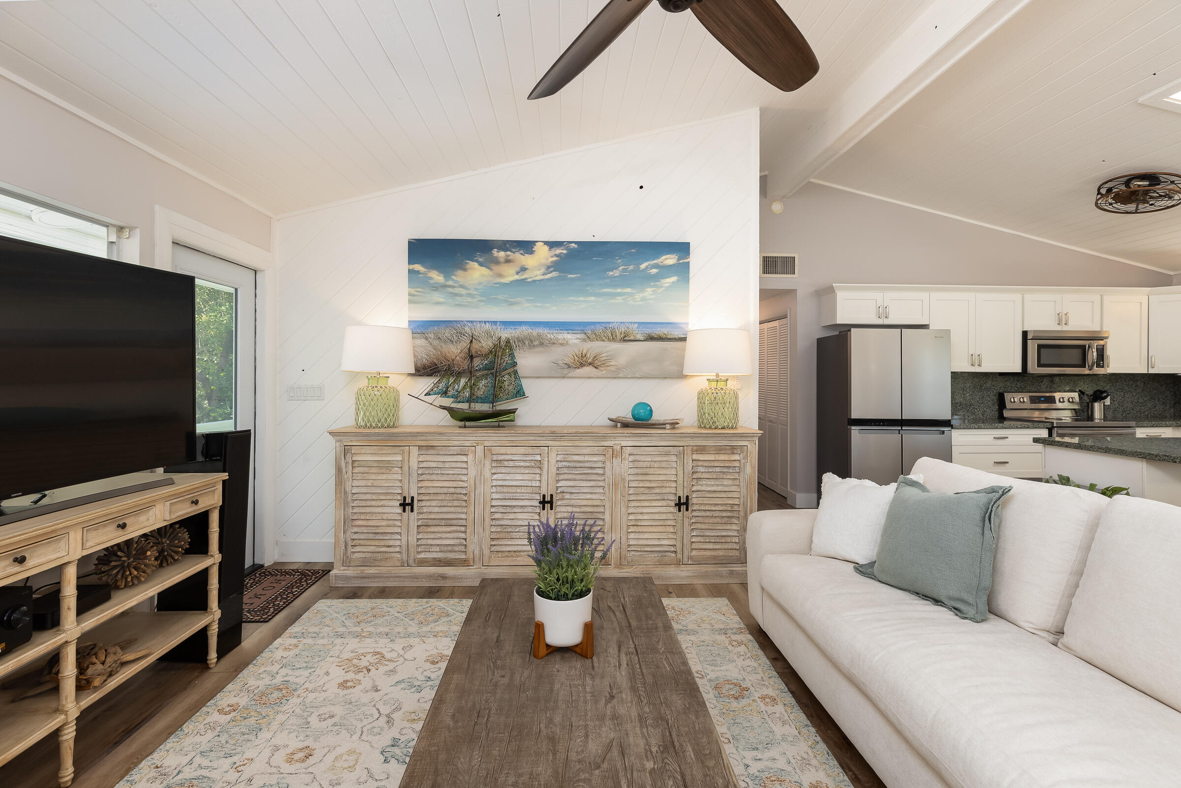 15 Sunset Road Key Largo, FL 33037 - Photo 22 of 58 a living room with furniture and a flat screen tv