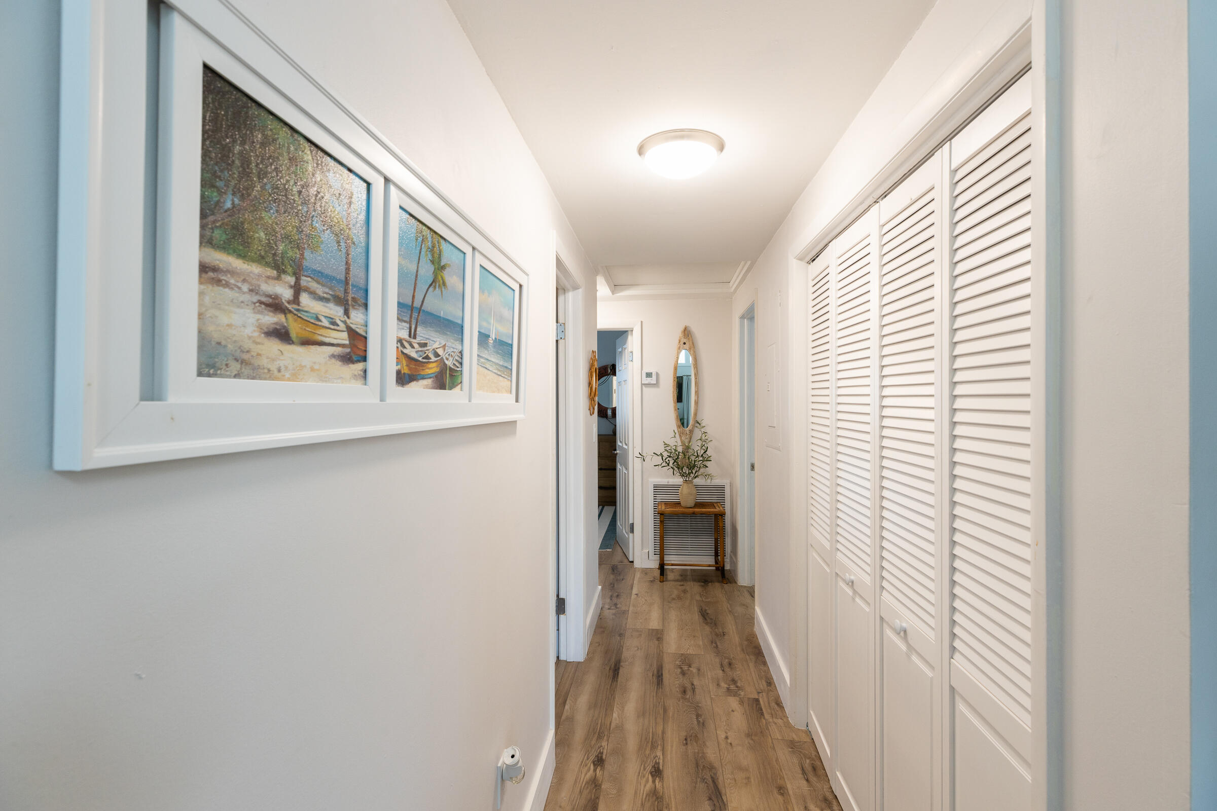 15 Sunset Road Key Largo, FL 33037 - Photo 24 of 58 a view of a hallway with a window and wooden floor