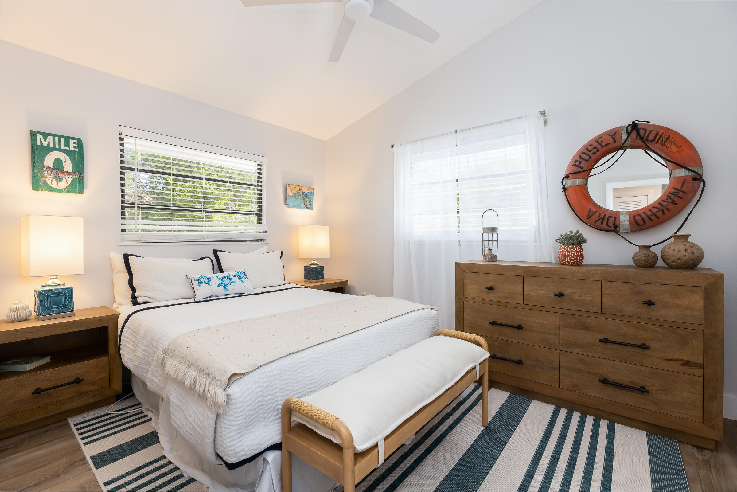 15 Sunset Road Key Largo, FL 33037 - Photo 30 of 58 a bedroom with a bed and a mirror on the dresser