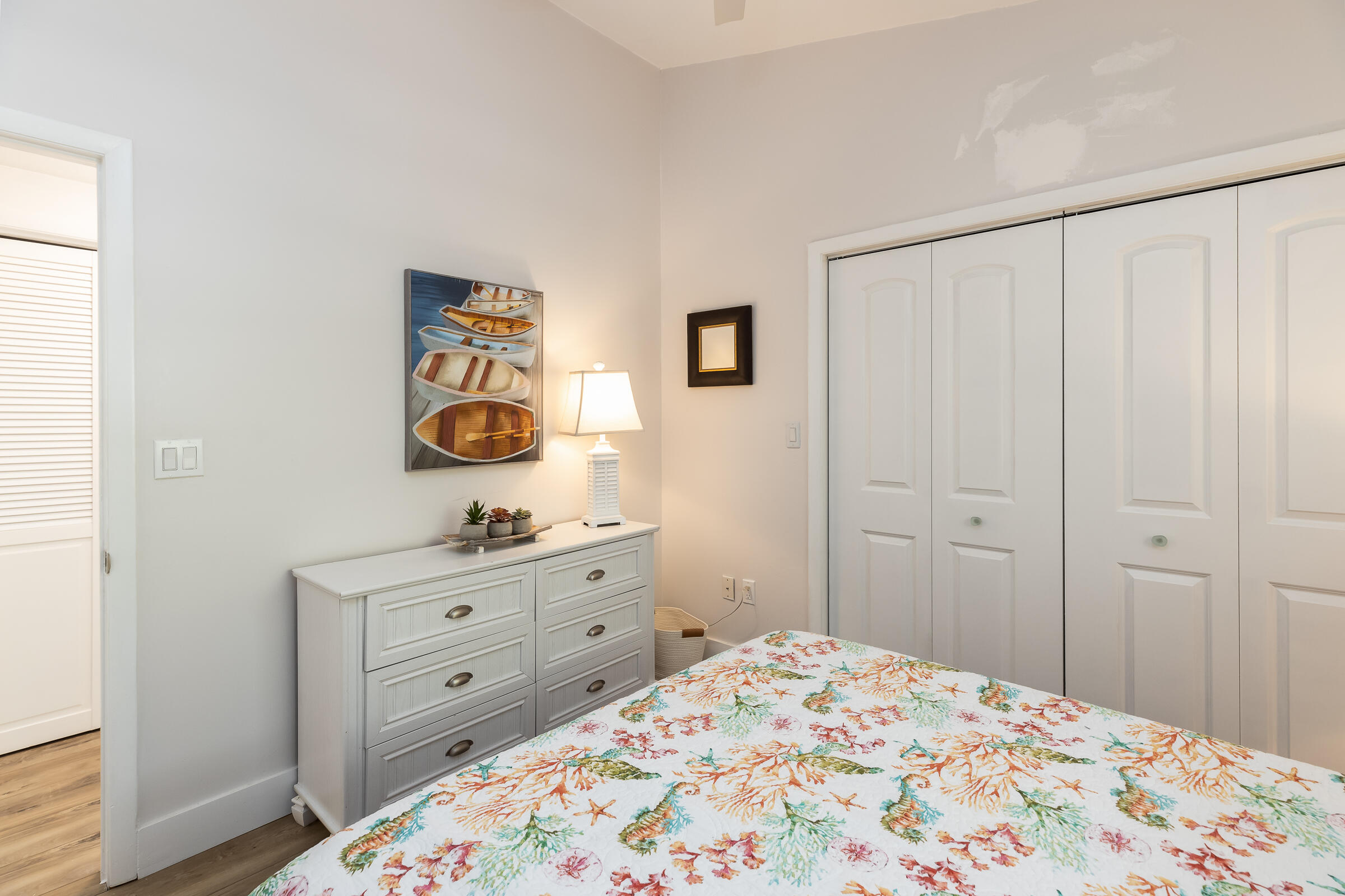 15 Sunset Road Key Largo, FL 33037 - Photo 34 of 58 a bedroom with a bed and a dresser in it