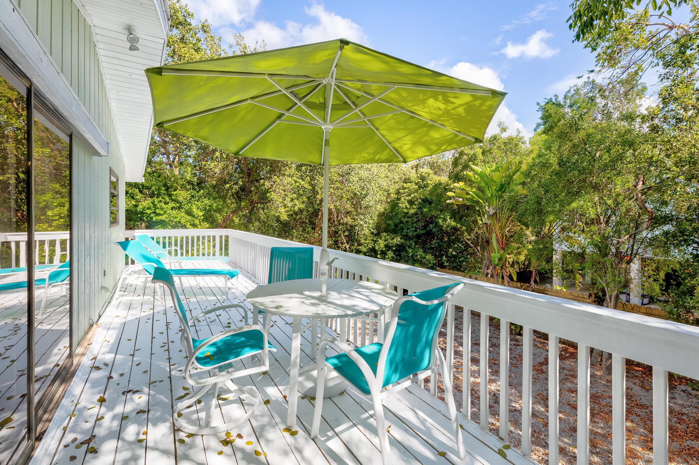 15 Sunset Road Key Largo, FL 33037 - Photo 38 of 58 a view of balcony with furniture and umbrella