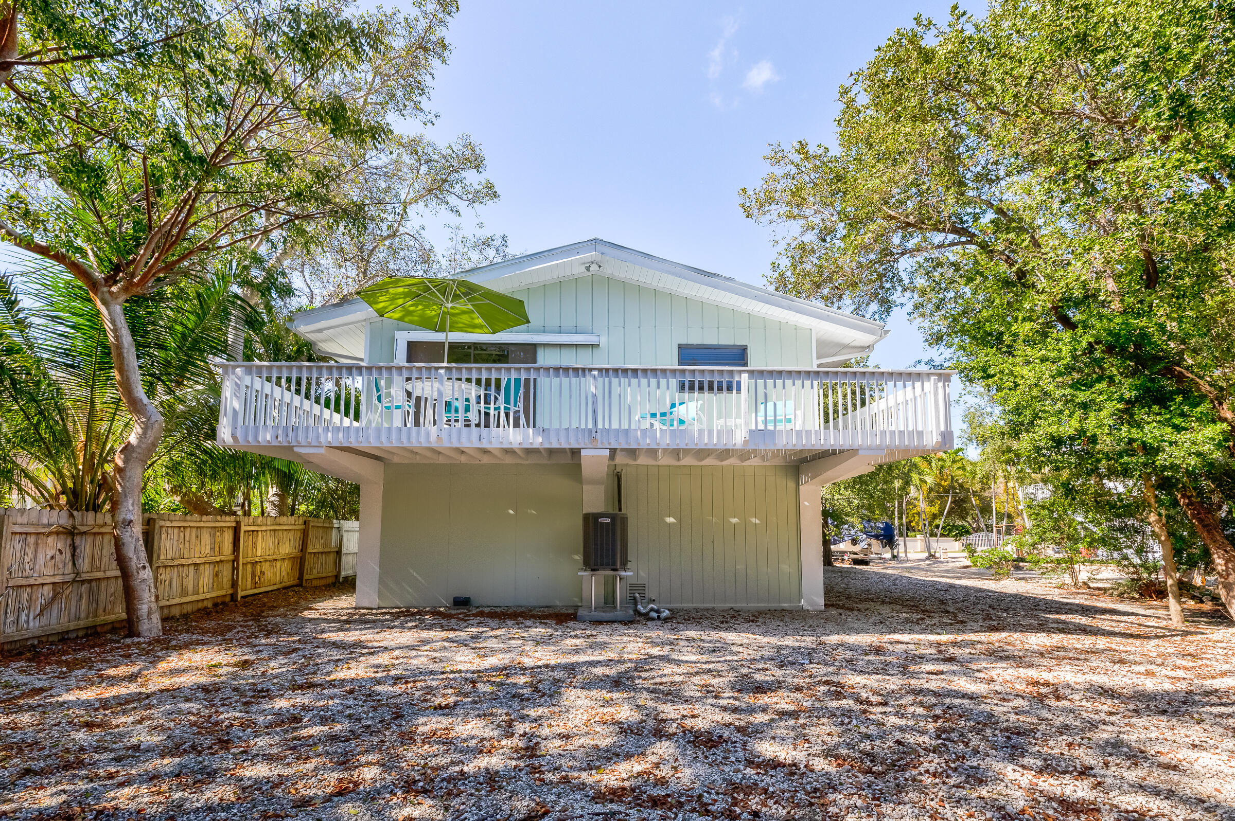 15 Sunset Road Key Largo, FL 33037 - Photo 39 of 58 a view of a house with a yard and a garage