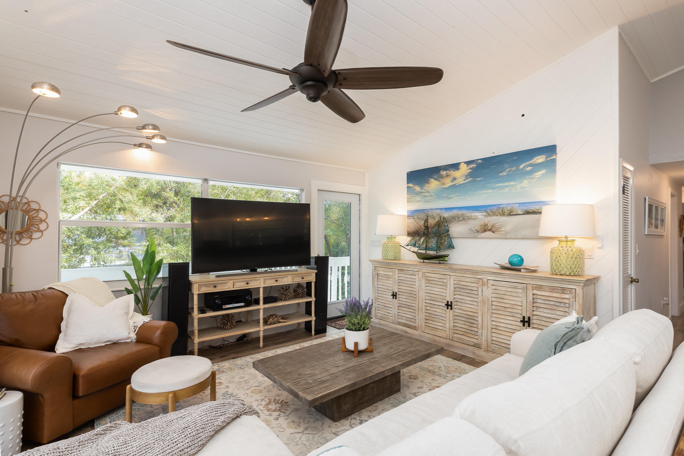 15 Sunset Road Key Largo, FL 33037 - Photo 4 of 58 a living room with furniture and a flat screen tv