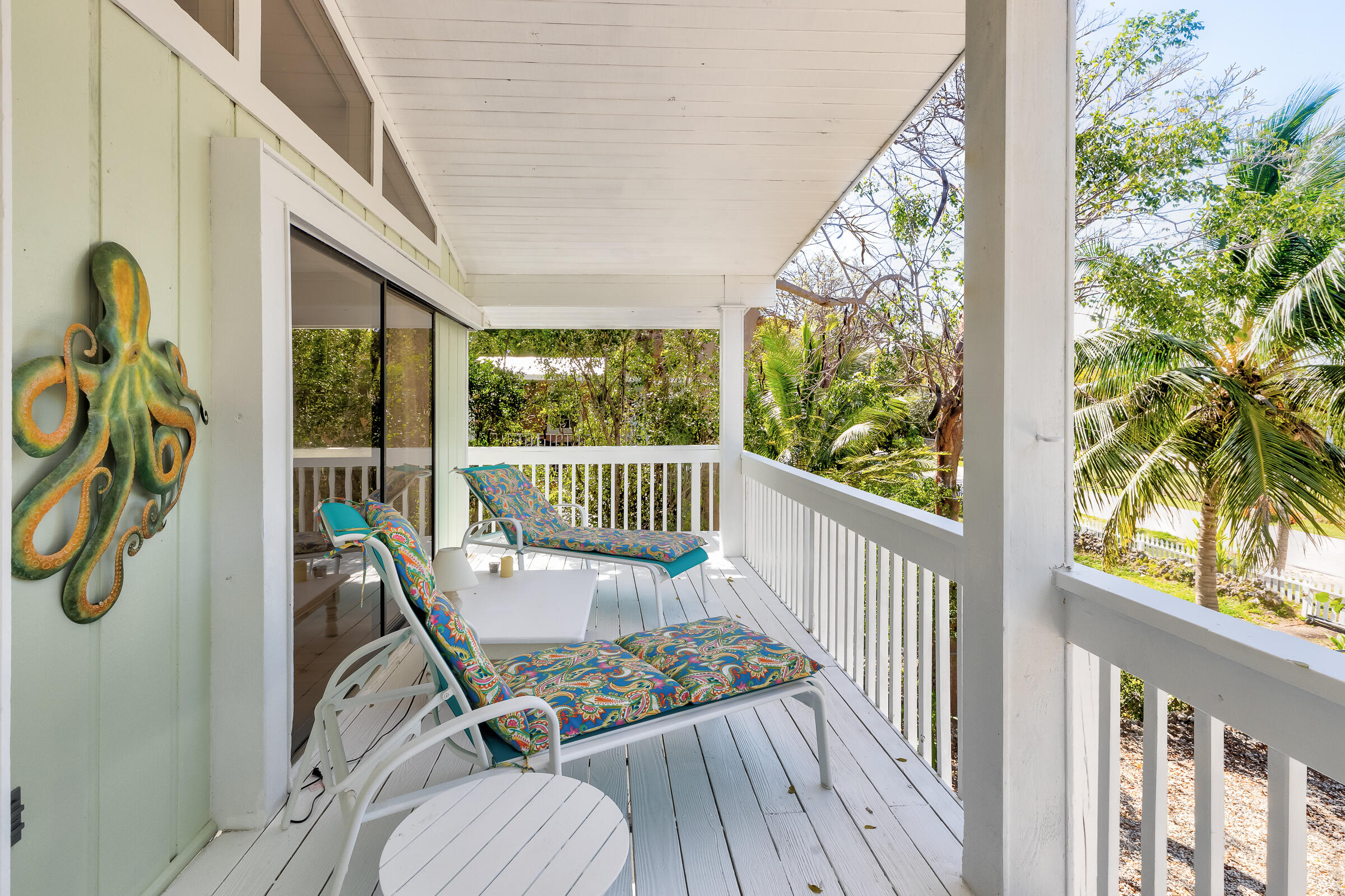 15 Sunset Road Key Largo, FL 33037 - Photo 45 of 58 a view of a chair and tables in the balcony