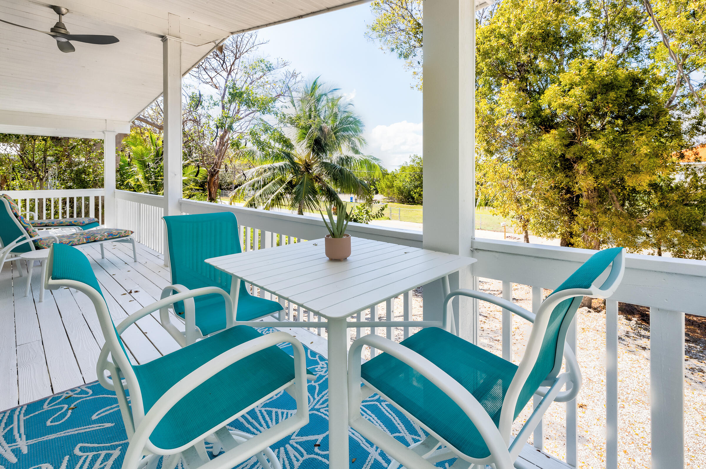 15 Sunset Road Key Largo, FL 33037 - Photo 47 of 58 a balcony view with a table and chairs