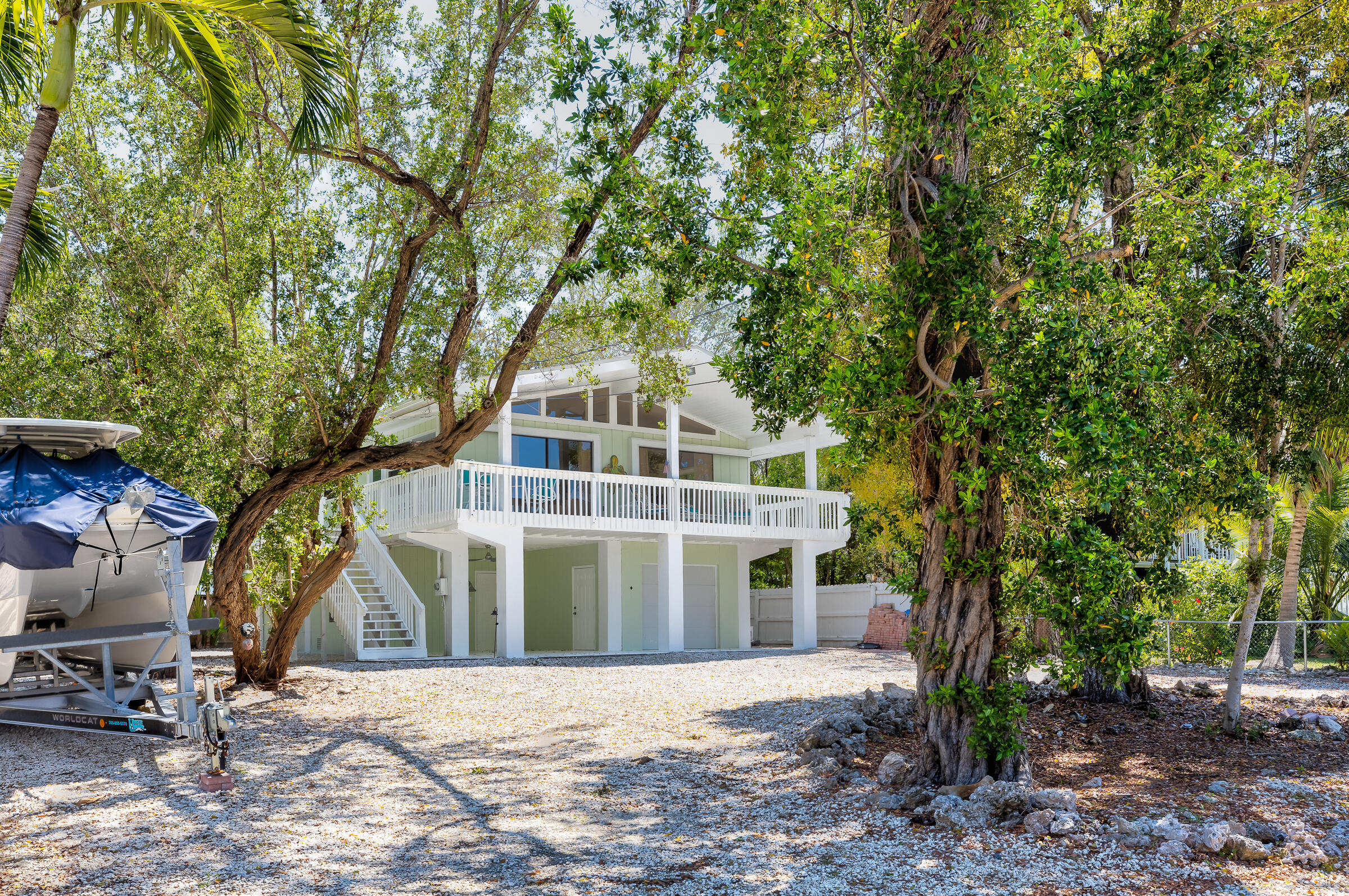 15 Sunset Road Key Largo, FL 33037 - Photo 57 of 58 a front view of a house with a yard
