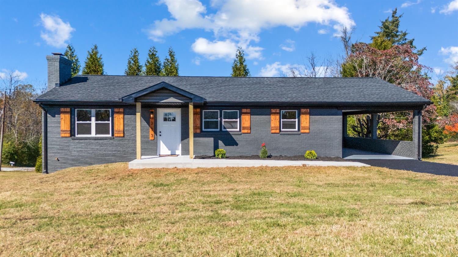 a front view of a house with a yard
