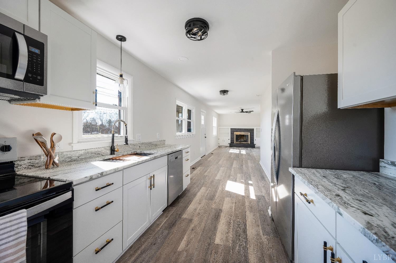 333 North Main Street Amherst, VA 24521 - Photo 11 of 56 a large kitchen with a sink and cabinets