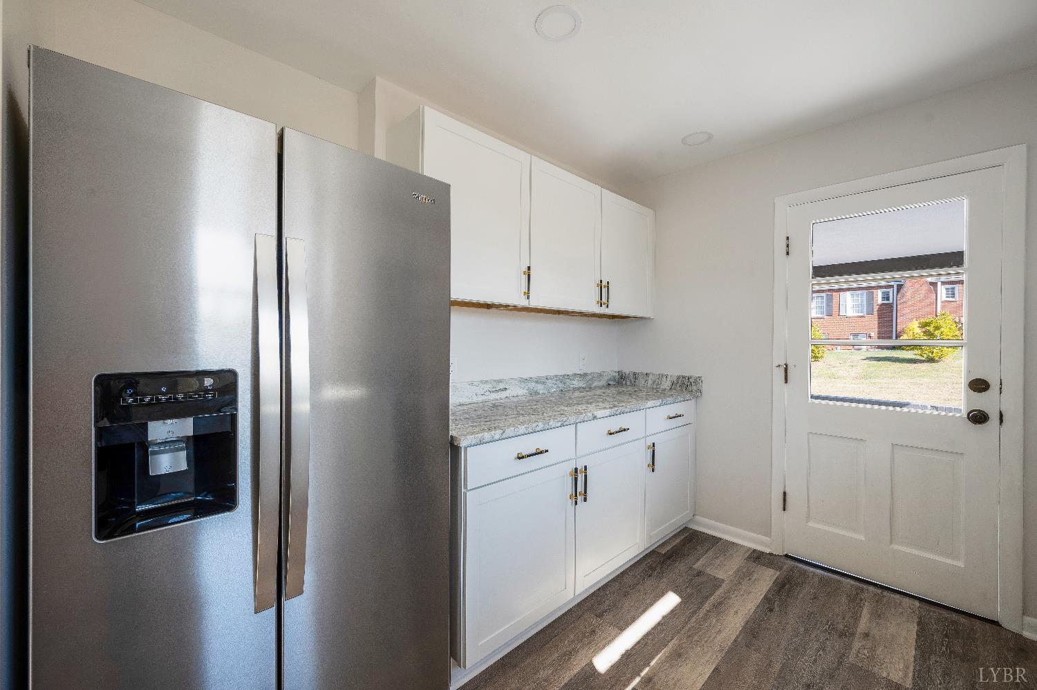 333 North Main Street Amherst, VA 24521 - Photo 12 of 56 a kitchen with stainless steel appliances granite countertop a refrigerator and a stove