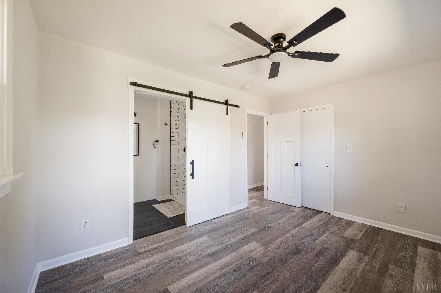333 North Main Street Amherst, VA 24521 - Photo 16 of 56 a view of an empty room with wooden floor