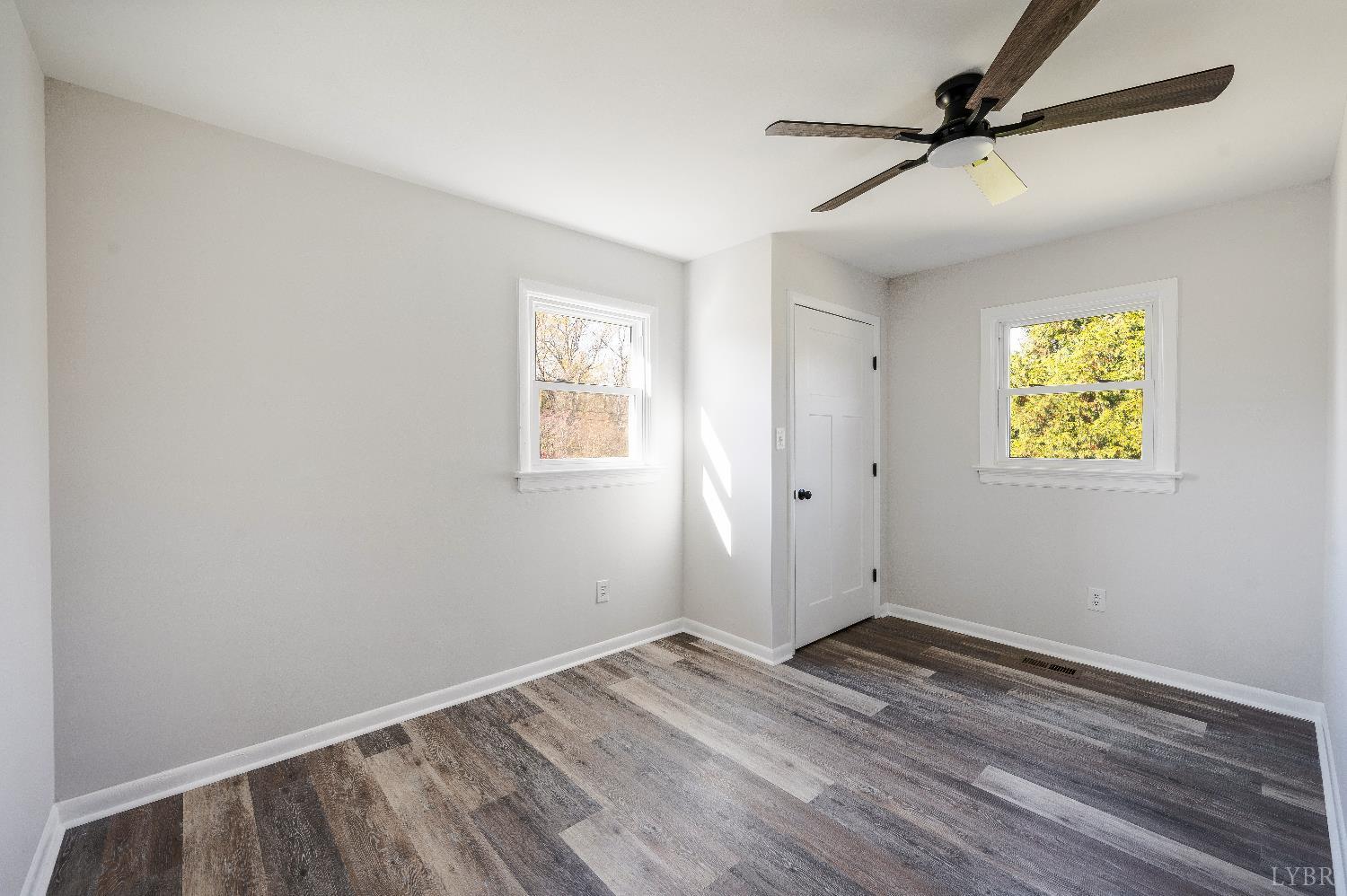 333 North Main Street Amherst, VA 24521 - Photo 27 of 56 wooden floor in an empty room with a window