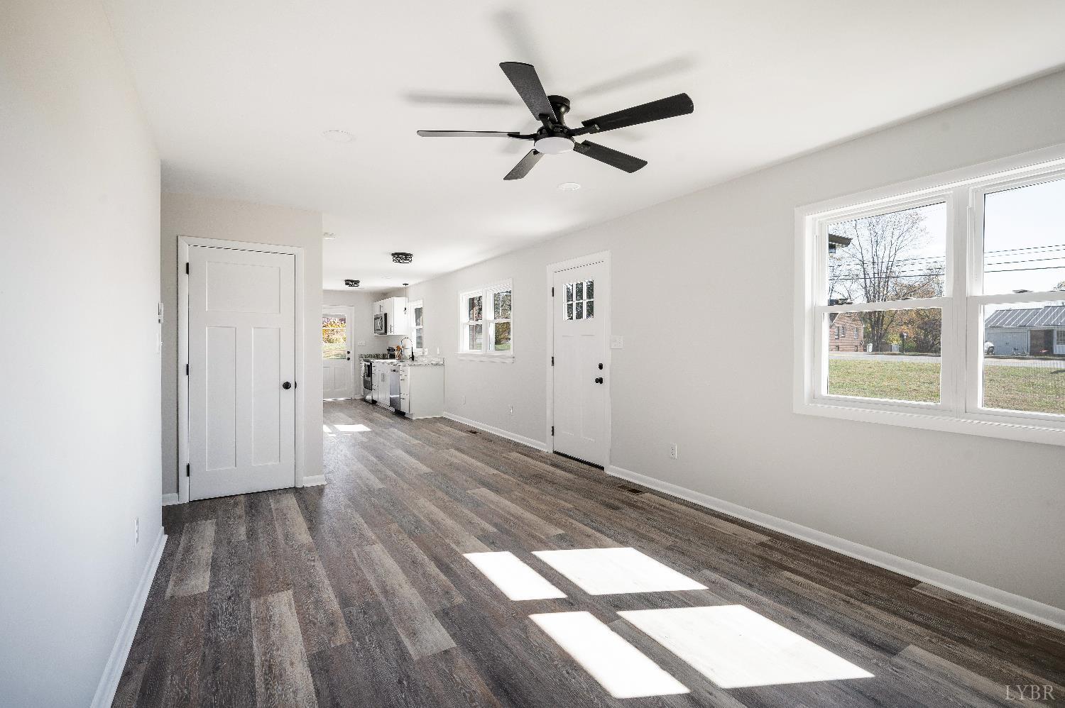 333 North Main Street Amherst, VA 24521 - Photo 5 of 56 a view of empty room with wooden floor and window