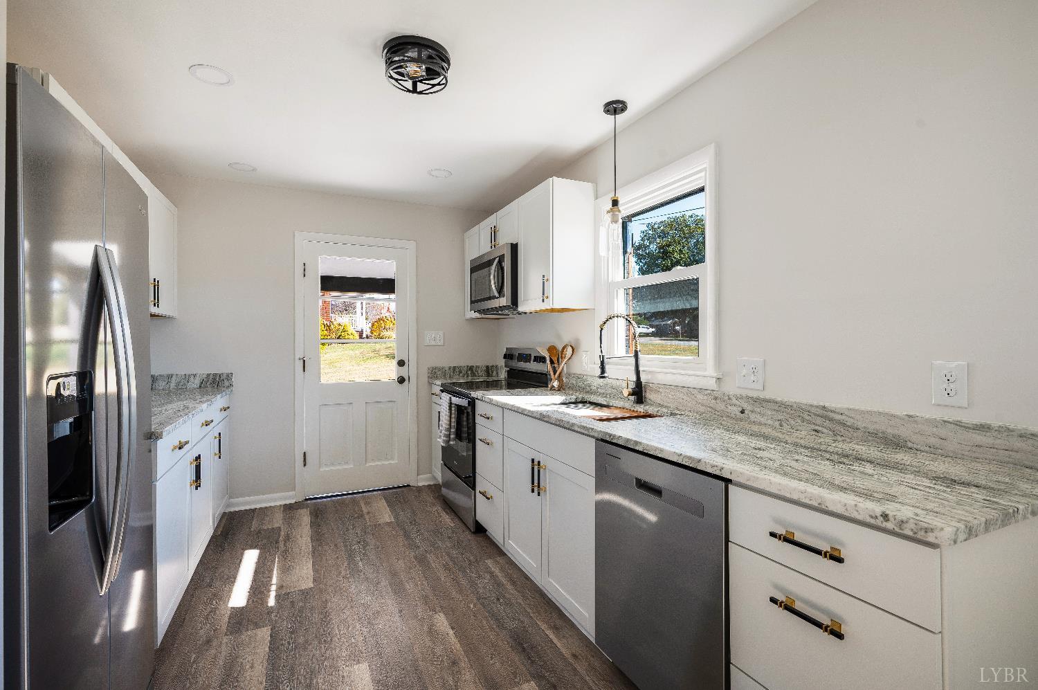 333 North Main Street Amherst, VA 24521 - Photo 8 of 56 a kitchen with a sink stove and refrigerator