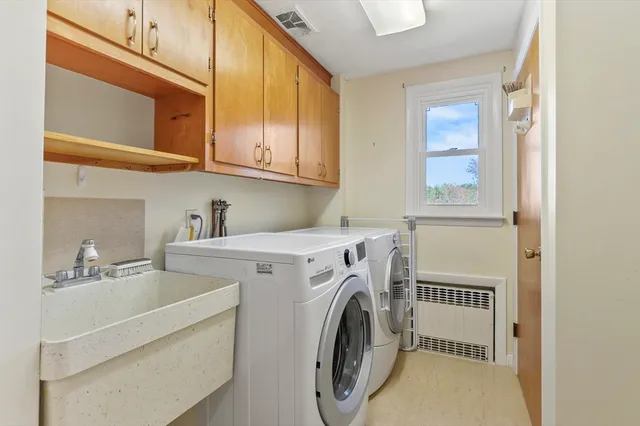 a utility room with dryer and washer