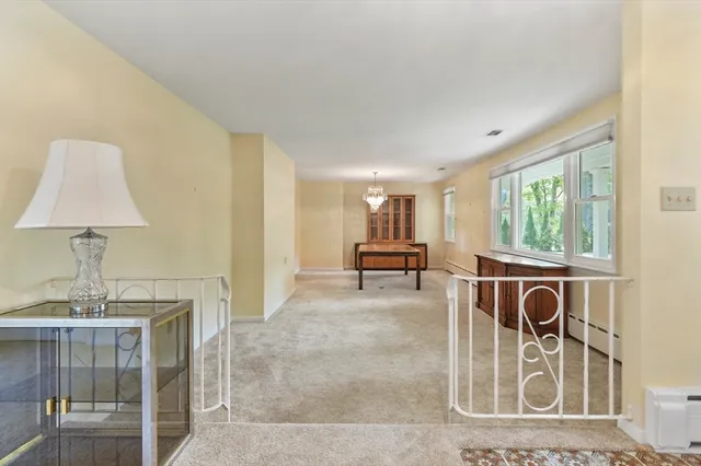 a view of a livingroom with furniture and window