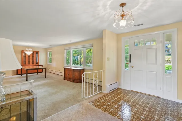 a view of a livingroom with furniture and windows