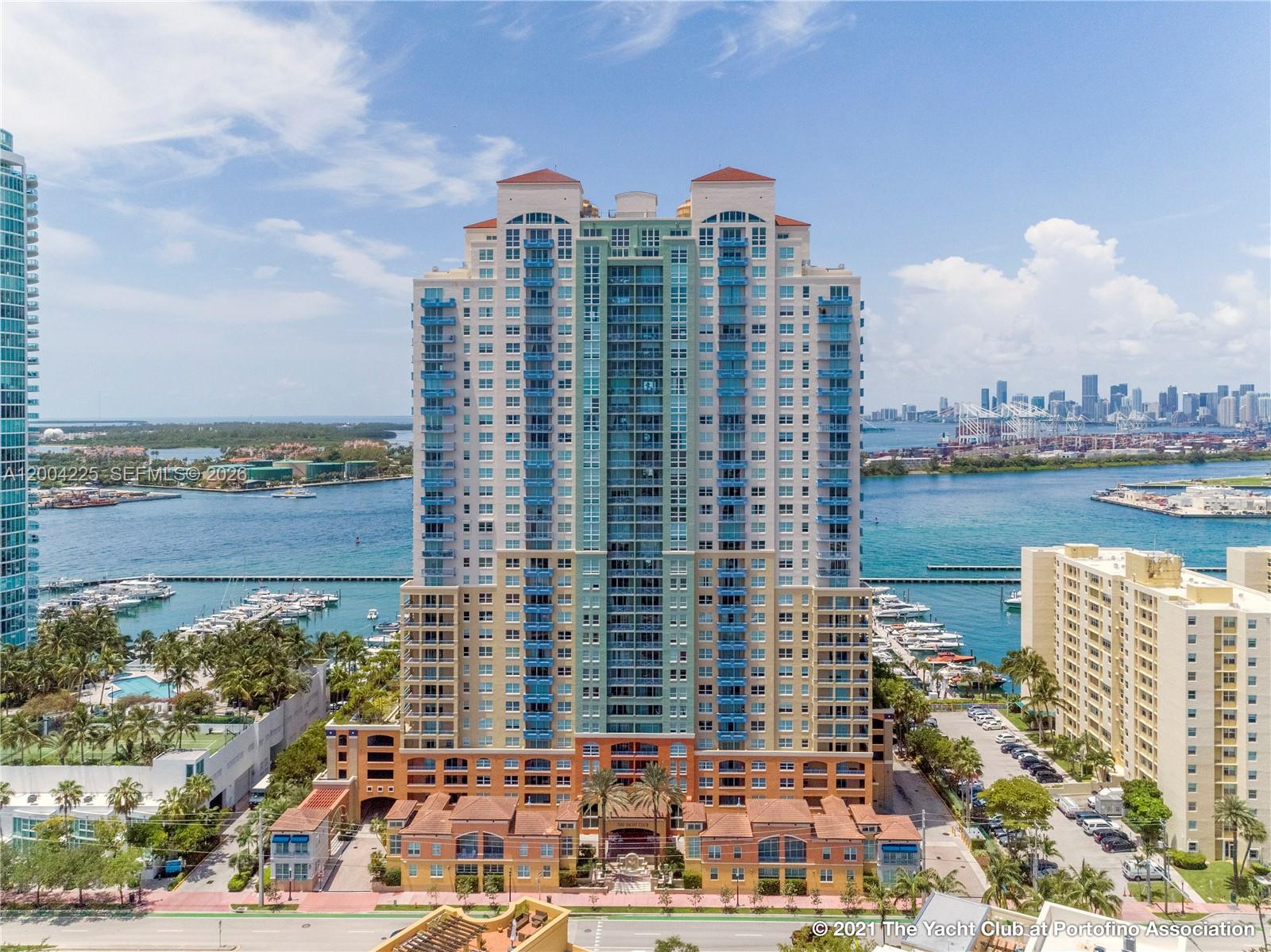90 Alton Road, Unit 301 Miami Beach, FL 33139 - Photo 11 of 18 a view of a city with tall buildings and a lake view