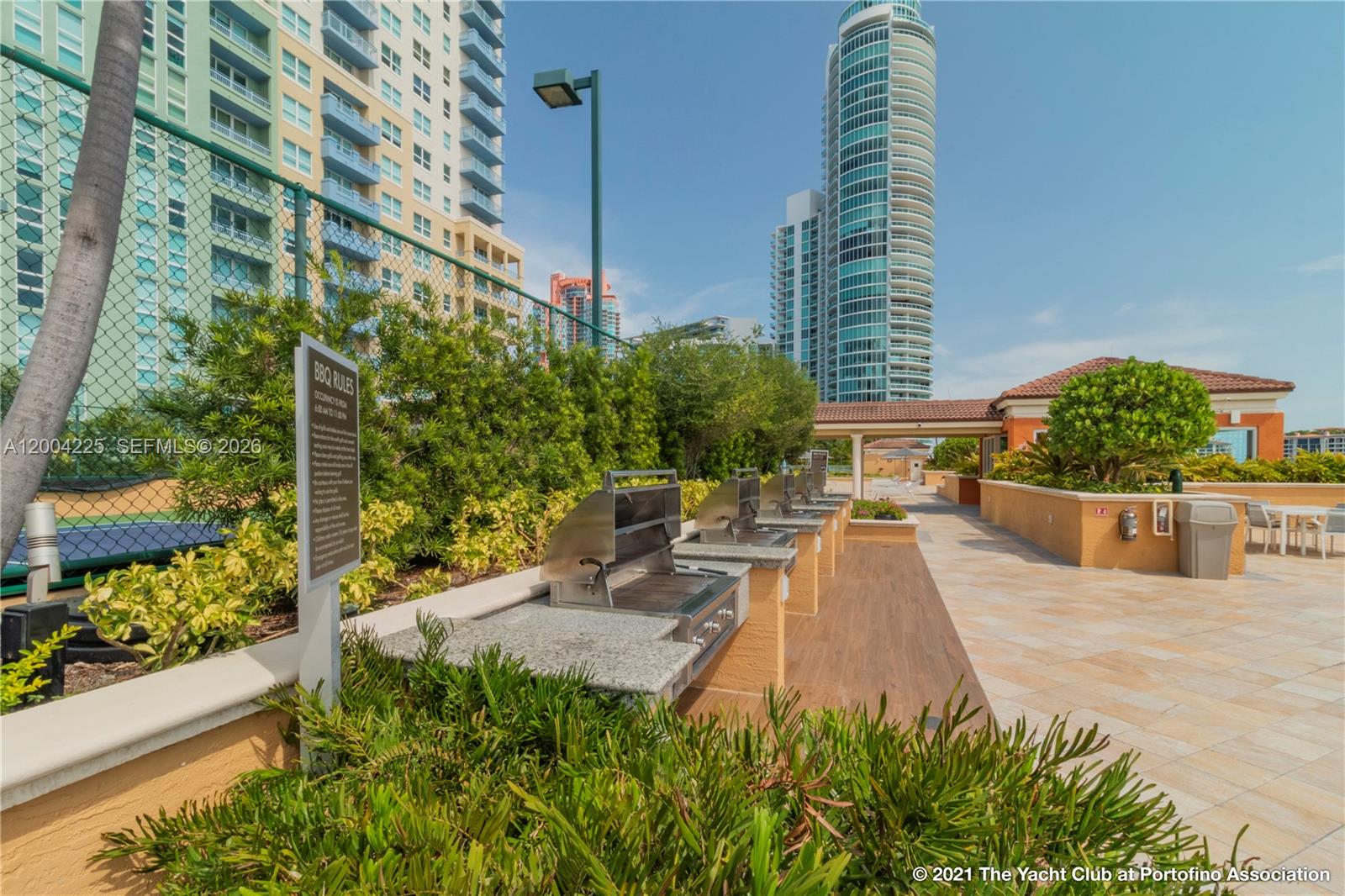 90 Alton Road, Unit 301 Miami Beach, FL 33139 - Photo 14 of 18 a view of a swimming pool with a patio
