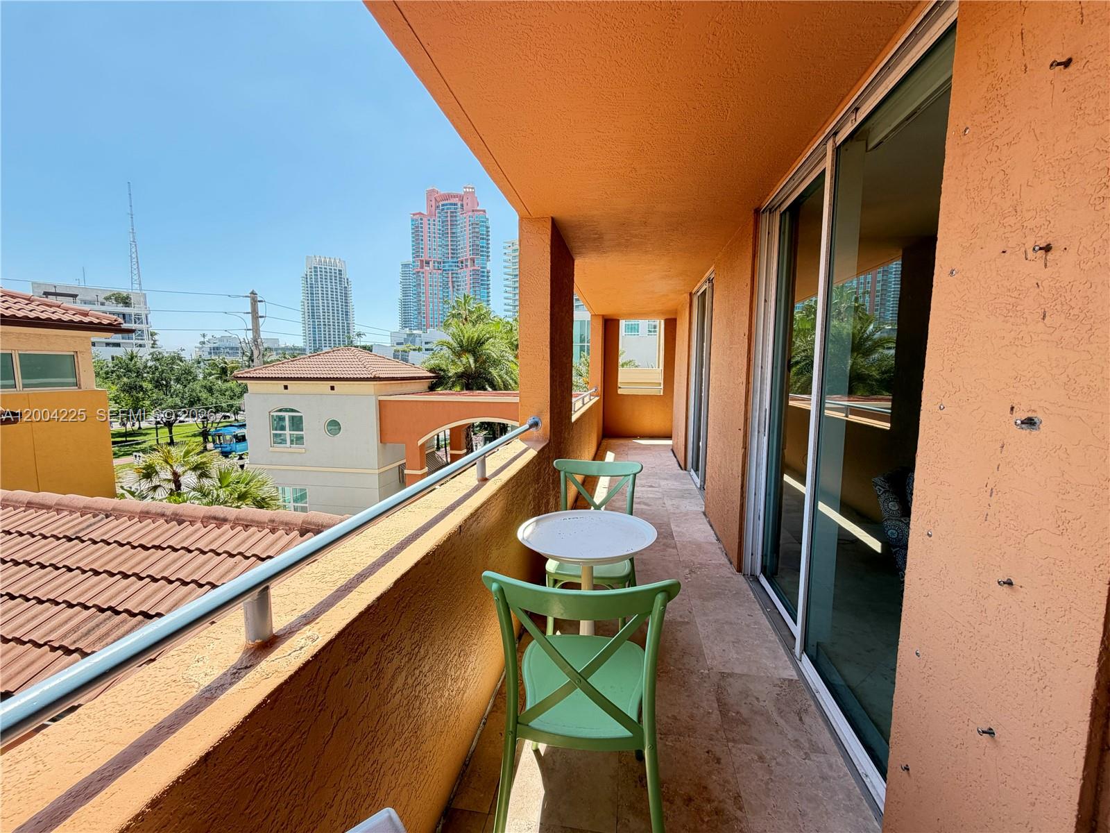 90 Alton Road, Unit 301 Miami Beach, FL 33139 - Photo 9 of 18 a outdoor space with furniture