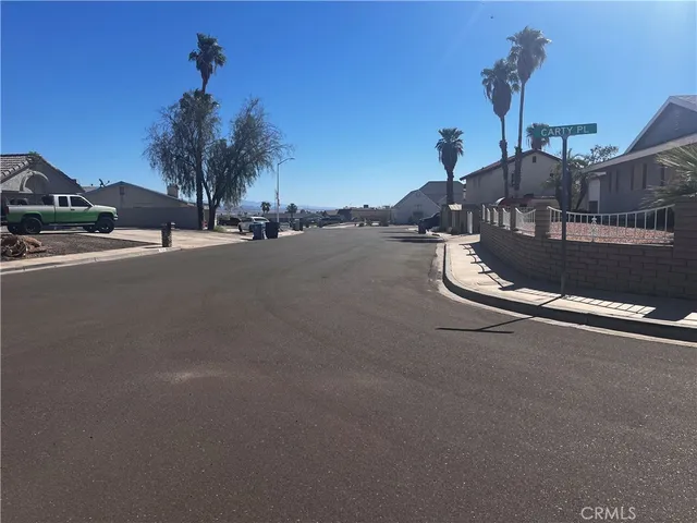 a ocean view with beach and car parked