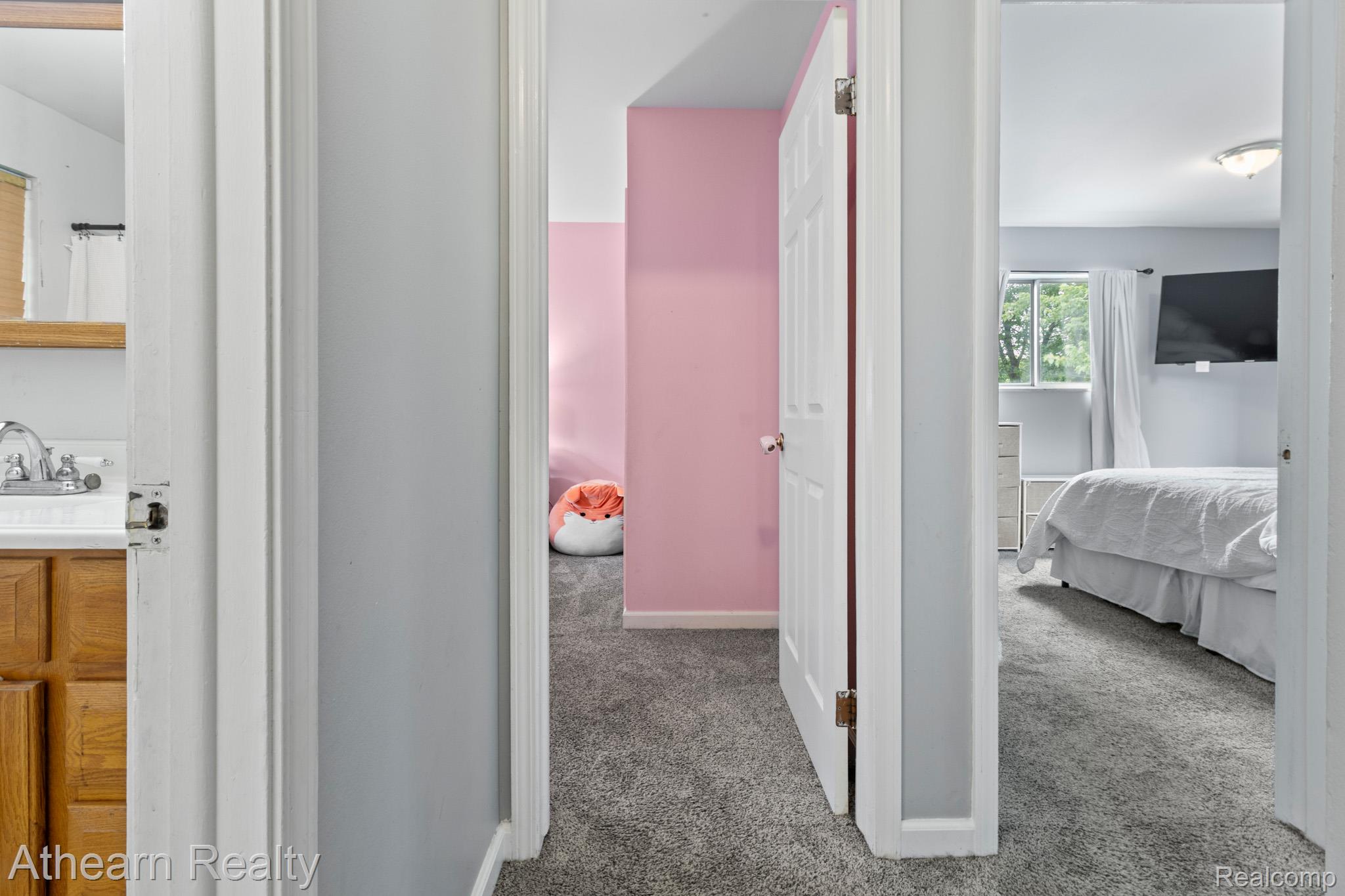 7156 Sharp Road Swartz Creek, MI 48473 - Photo 20 of 32 Hallway with light gray walls and plush gray carpeting