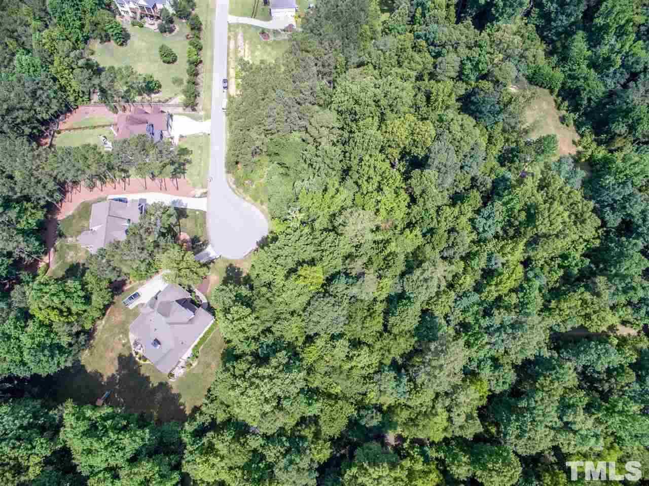 4717 Preserve Road Raleigh, NC 27610 - Photo 6 of 6 an aerial view of a house with a yard and garden