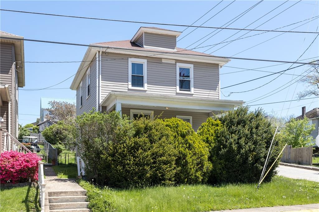 1334 Leeds Avenue Monessen, PA 15062 - Photo 3 of 5 a front view of a house with a garden