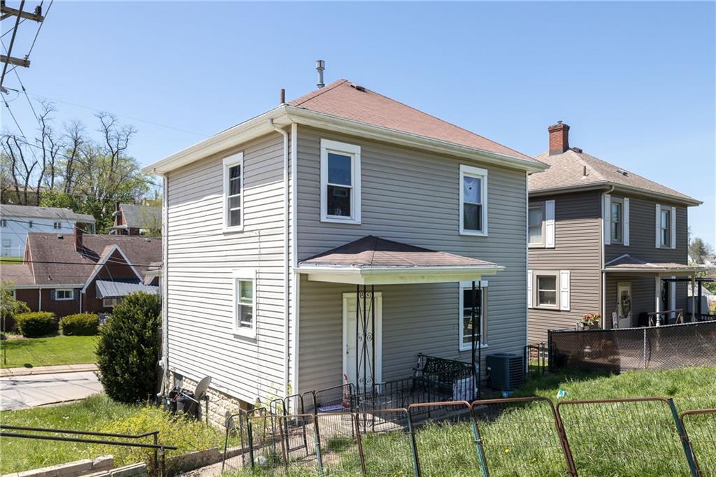1334 Leeds Avenue Monessen, PA 15062 - Photo 4 of 5 a front view of a house with a yard
