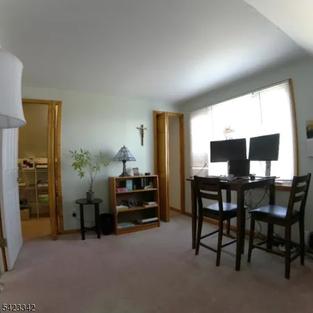 a view of a workspace with furniture