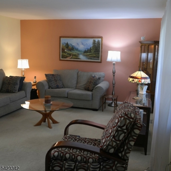 13 Summerall Road Somerset, NJ 08873 - Photo 2 of 21 a living room with furniture a lamp and a potted plant