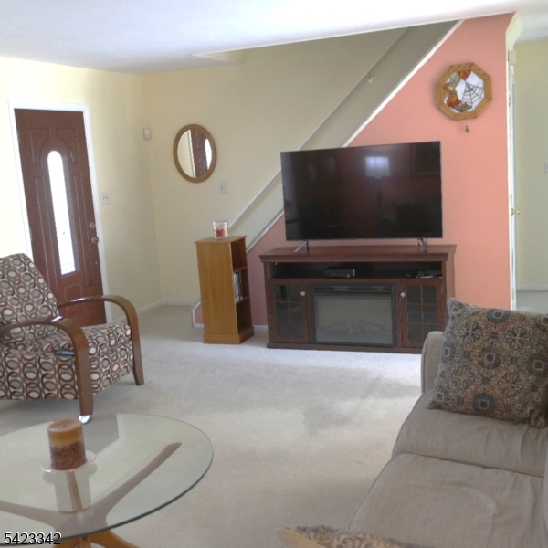 13 Summerall Road Somerset, NJ 08873 - Photo 3 of 21 a living room with furniture and a flat screen tv