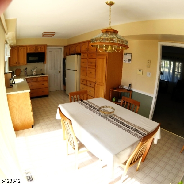 13 Summerall Road Somerset, NJ 08873 - Photo 10 of 21 a spacious bedroom with a bed a dresser and a flat screen tv