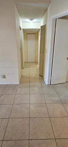 a kitchen with stainless steel appliances cabinets a sink and a stove