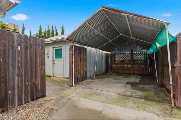 a view of a backyard with sitting area