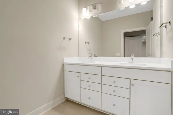 a bathroom with a shower a toilet and sink