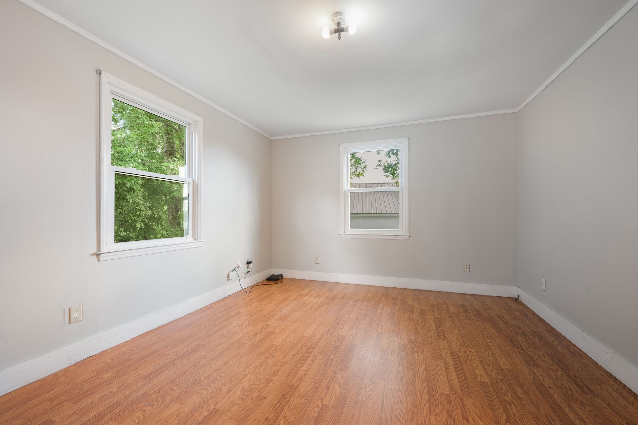109 Riverside Drive Centerville, TN 37033 - Photo 23 of 29 a view of an empty room with wooden floor and a window